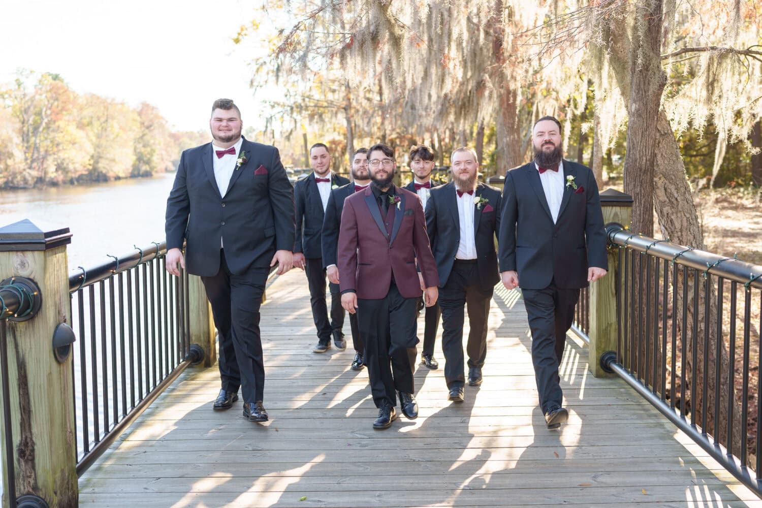 Groom walking with the groomsmen - The Cypress Inn - Conway, SC