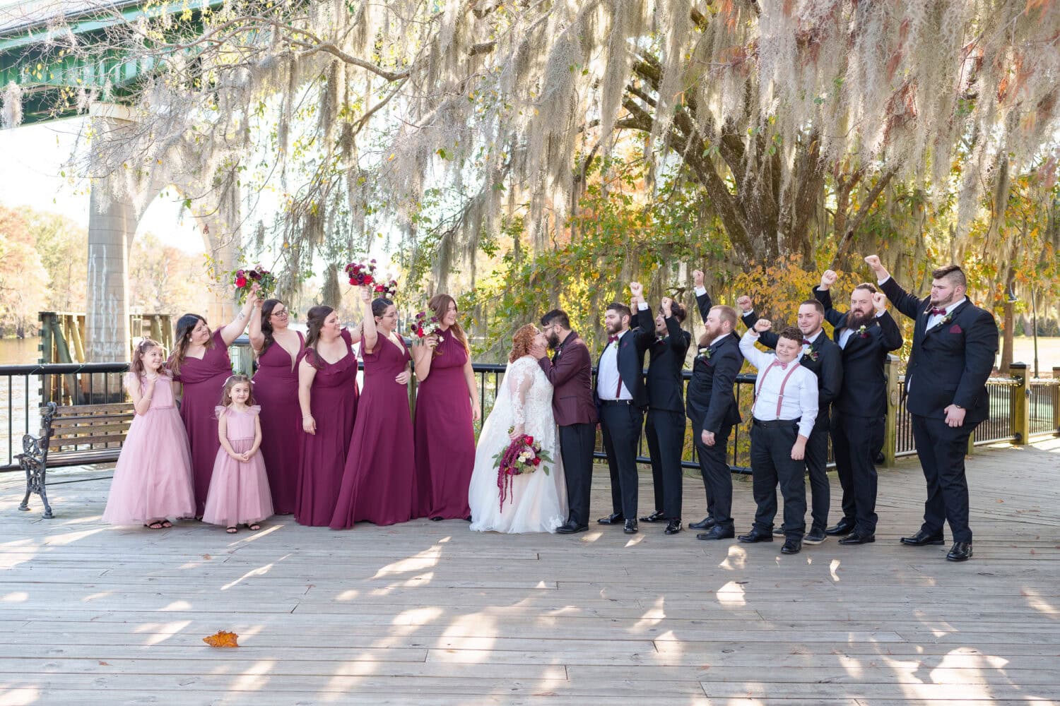 Kiss with cheers from the wedding party - The Cypress Inn - Conway, SC