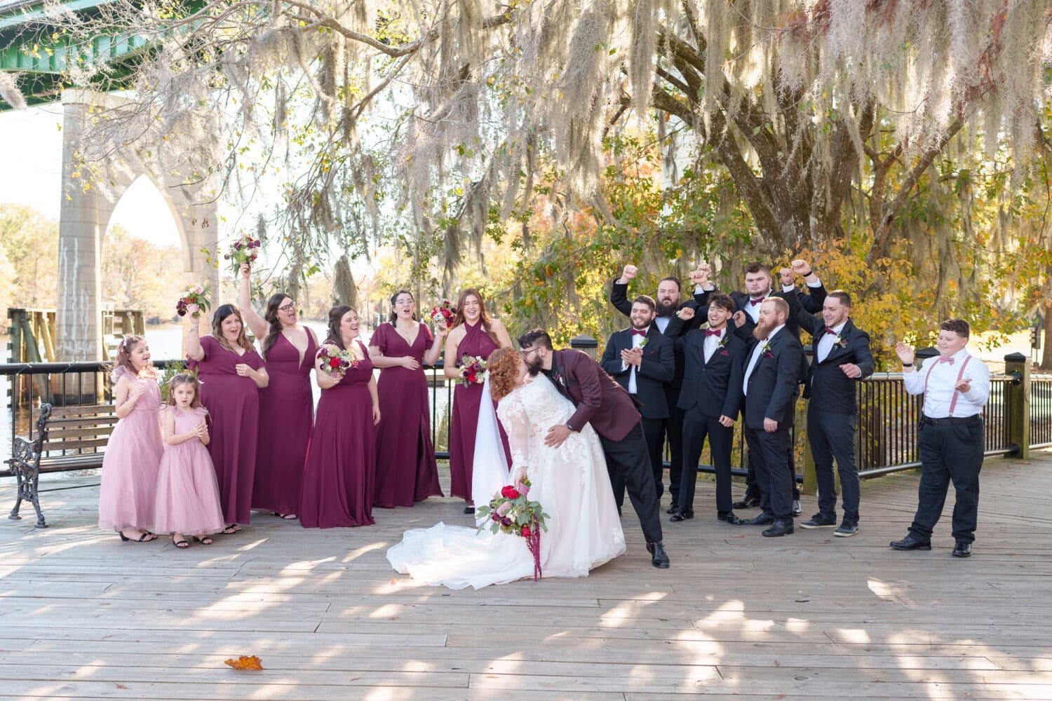 Kiss with cheers from the wedding party - The Cypress Inn - Conway, SC