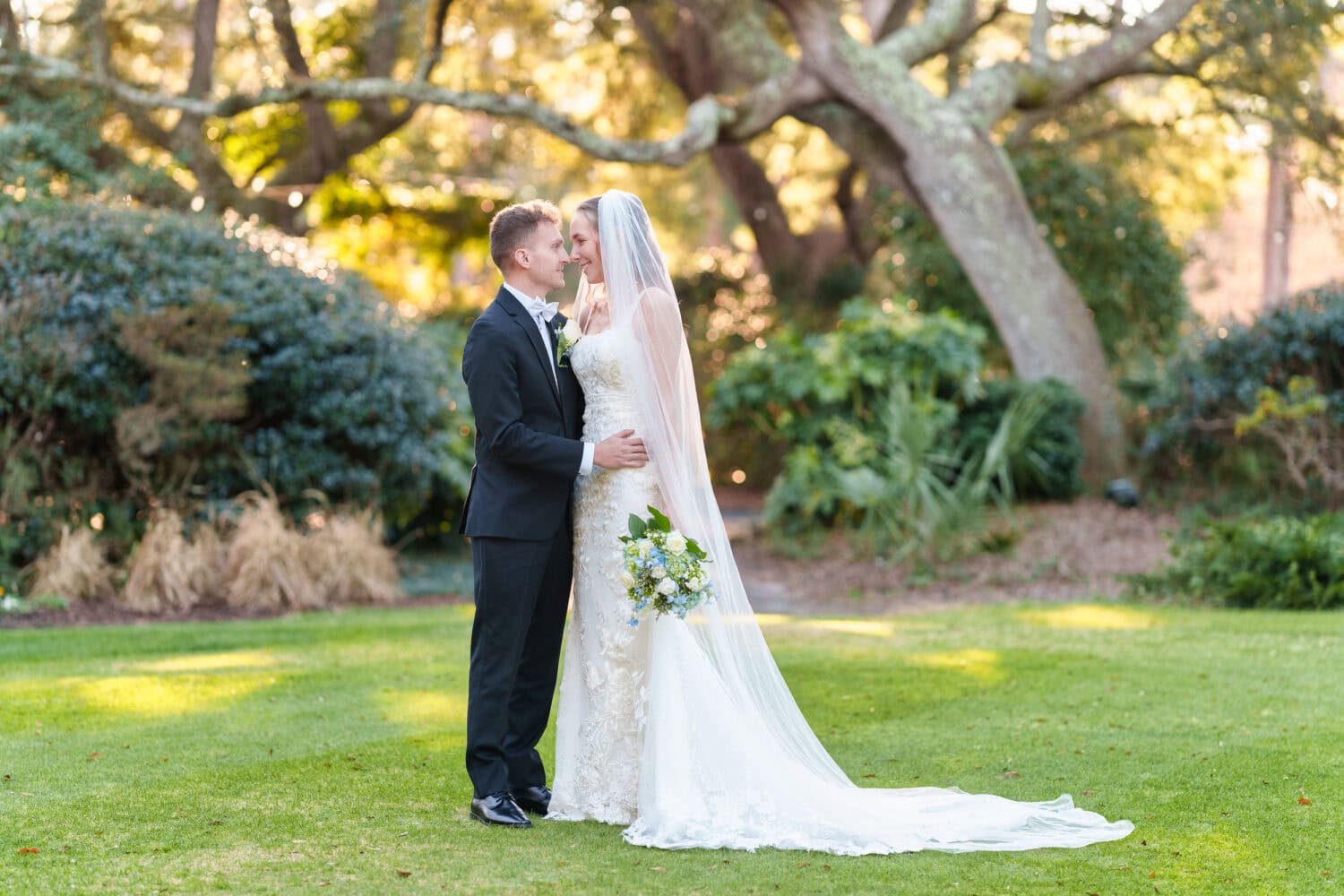 Looking into each other's eyes in front of the oaks - Litchfield Country Club