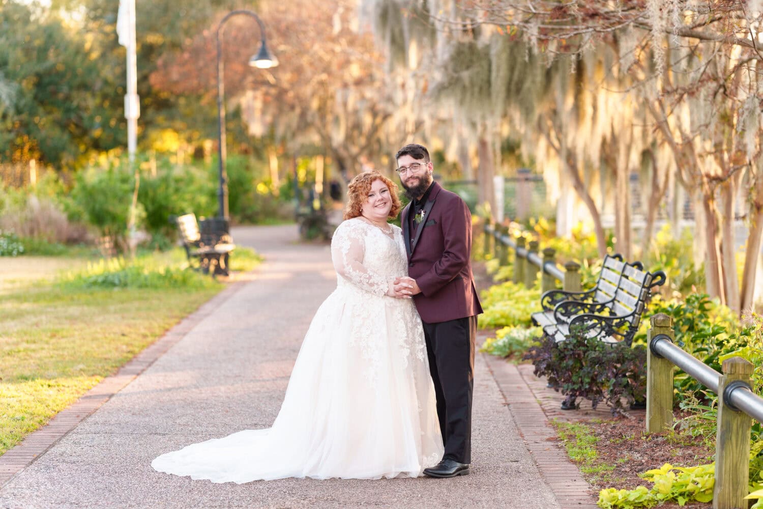 Portraits of the bride and groom under the moss covered path - The Cypress Inn - Conway, SC