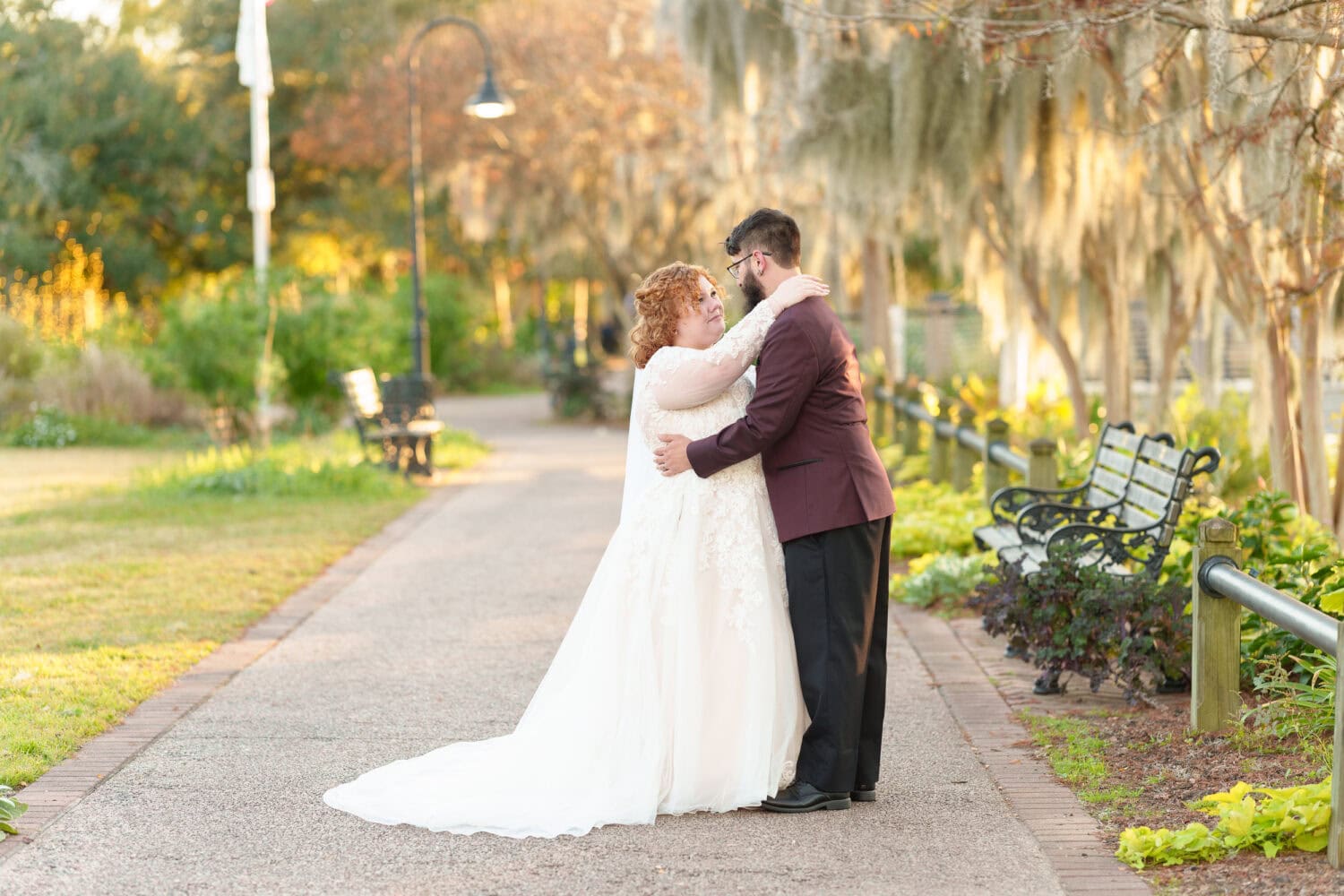 Portraits of the bride and groom under the moss covered path - The Cypress Inn - Conway, SC