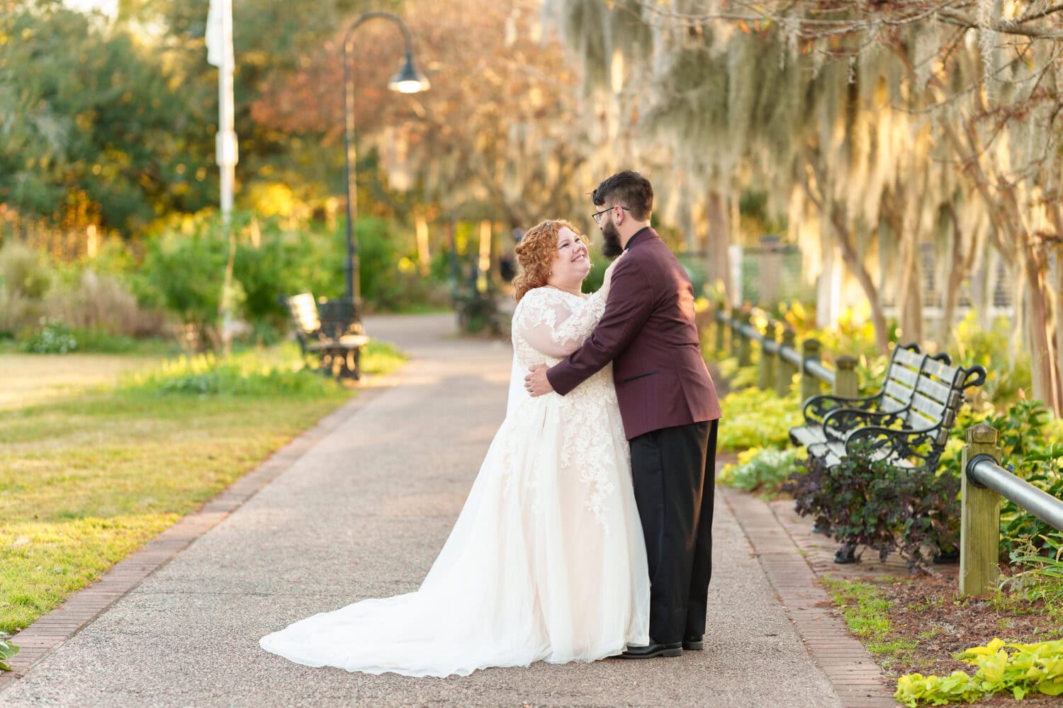 Portraits of the bride and groom under the moss covered path - The Cypress Inn - Conway, SC