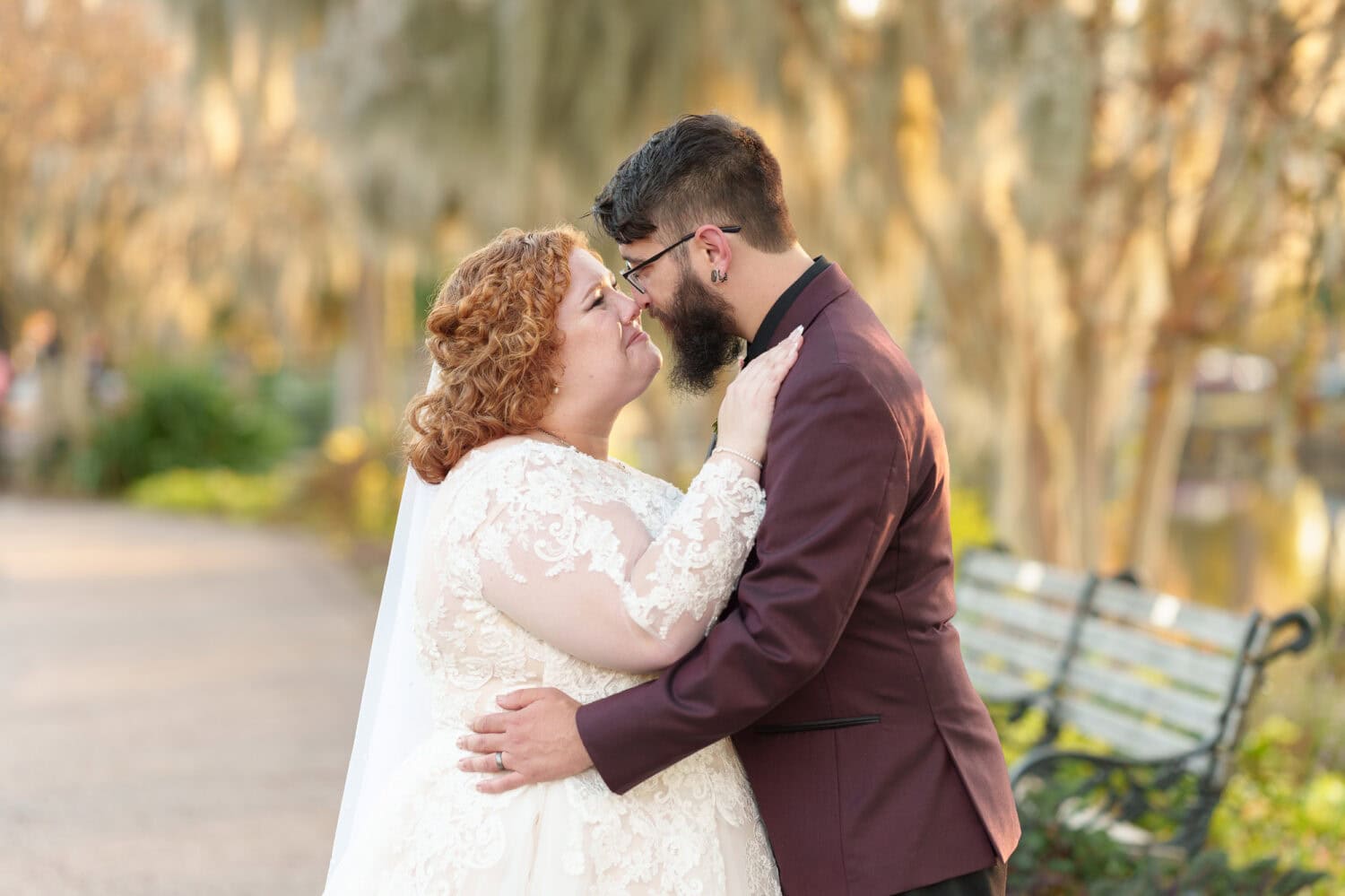 Portraits of the bride and groom under the moss covered path - The Cypress Inn - Conway, SC