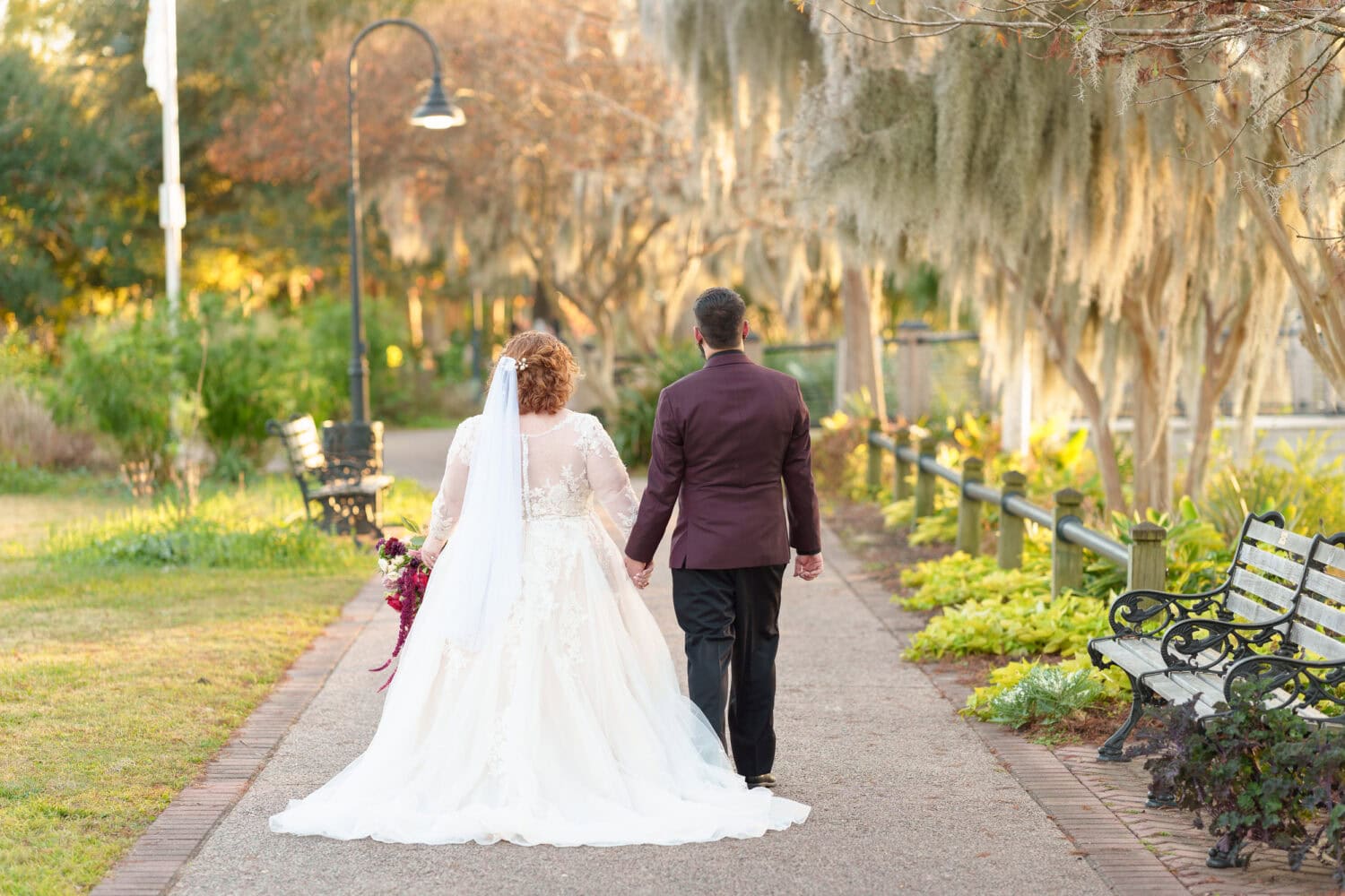 Portraits of the bride and groom under the moss covered path - The Cypress Inn - Conway, SC