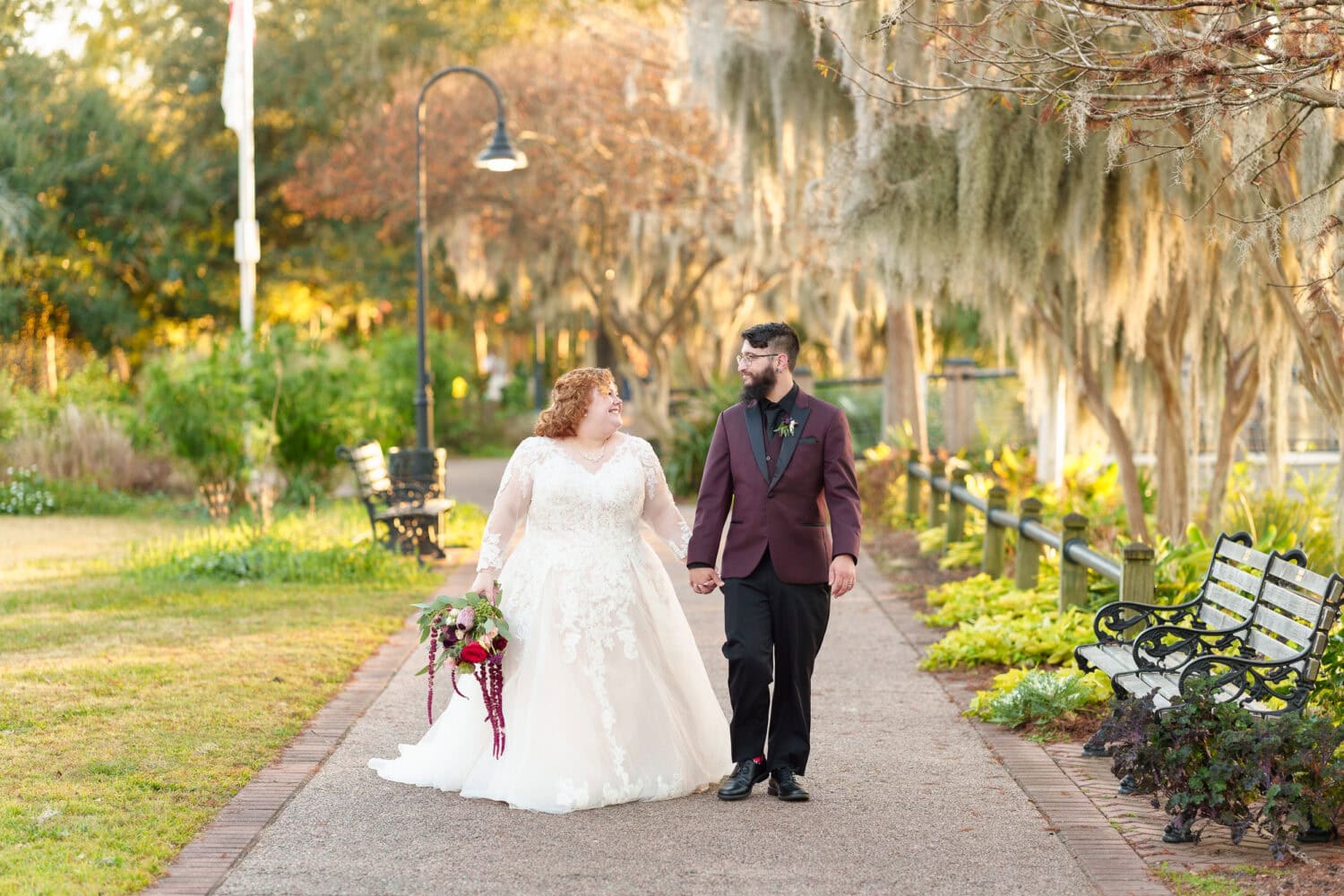 Portraits of the bride and groom under the moss covered path - The Cypress Inn - Conway, SC