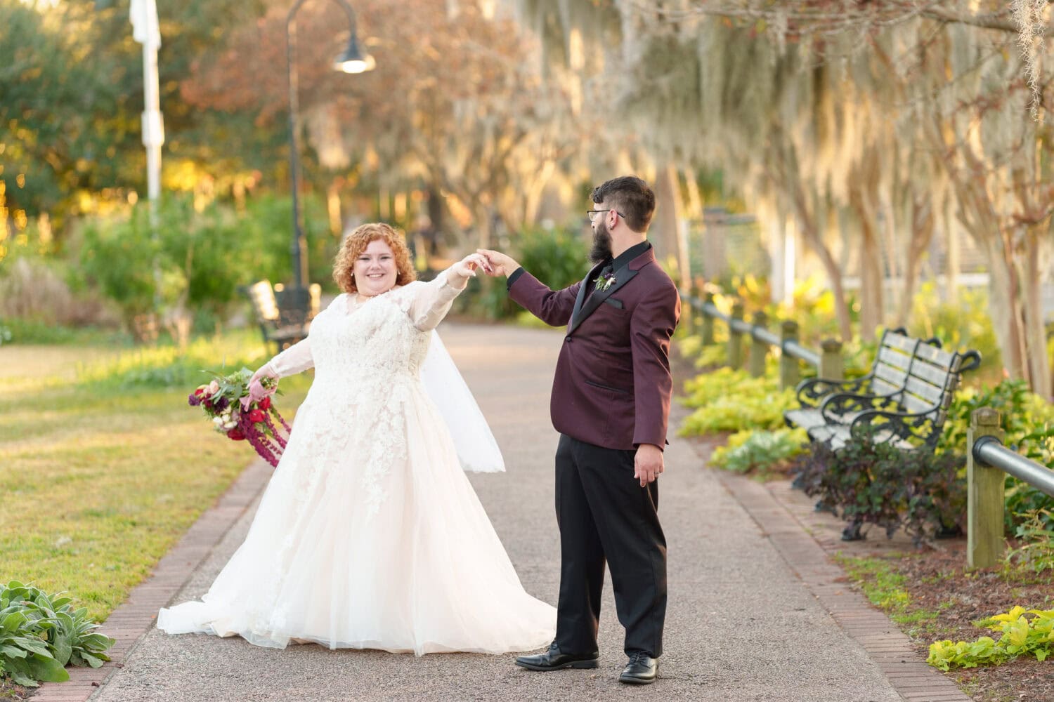 Portraits of the bride and groom under the moss covered path - The Cypress Inn - Conway, SC