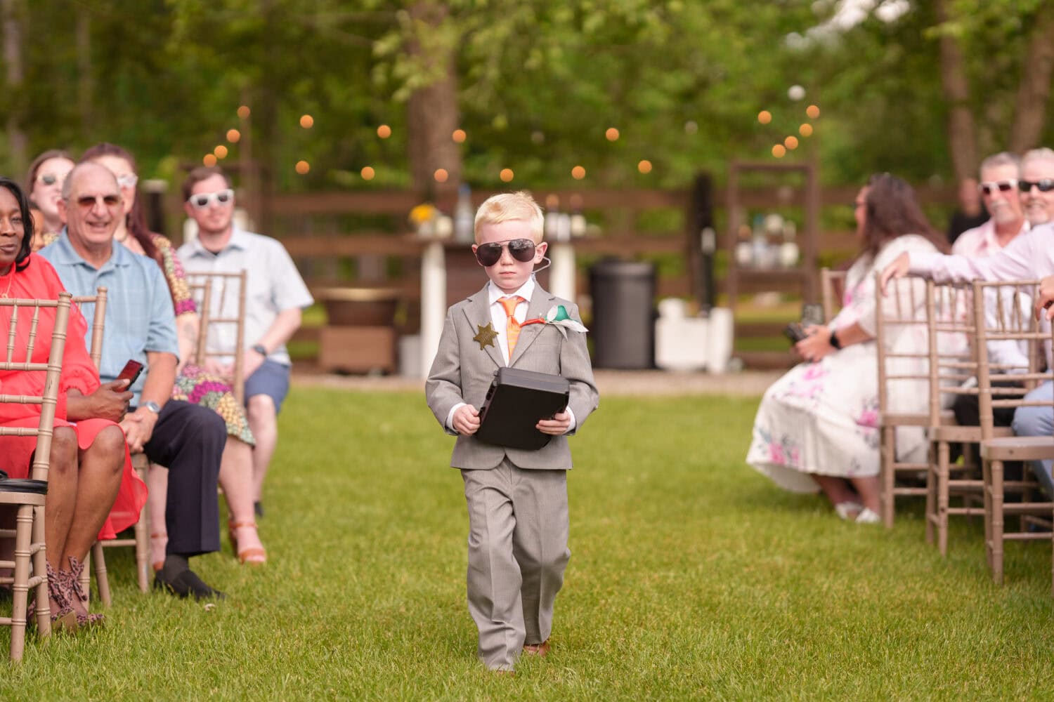 Ring bearer with security case and sunglasses - Wildhorse at Parker Farms